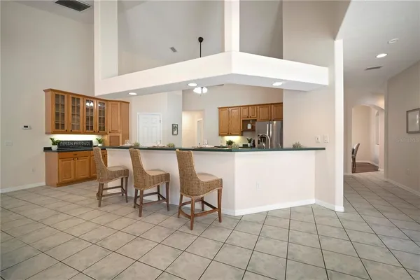 a spacious bedroom with a bed and a window