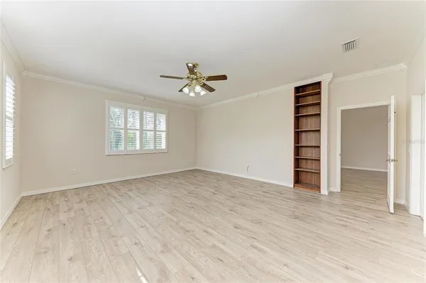 a view of an empty room with a window
