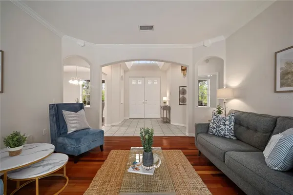 a bathroom with a granite countertop sink a toilet and a mirror
