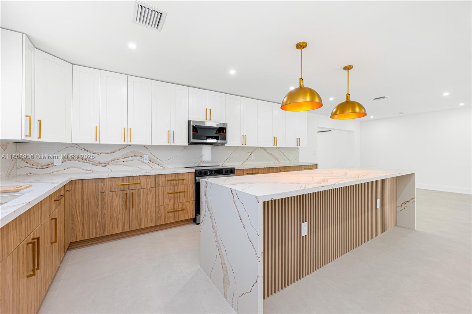 11835 Southwest 37th Street Miami, FL 33175 - Photo 13 of 47 a kitchen with kitchen island granite countertop wooden cabinets a stove a sink and a dishwasher