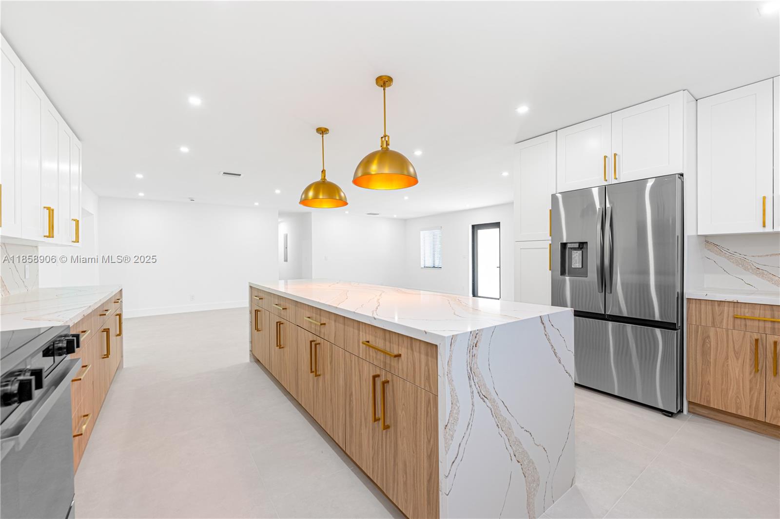 11835 Southwest 37th Street Miami, FL 33175 - Photo 14 of 47 a kitchen with stainless steel appliances granite countertop a sink a stove and a refrigerator