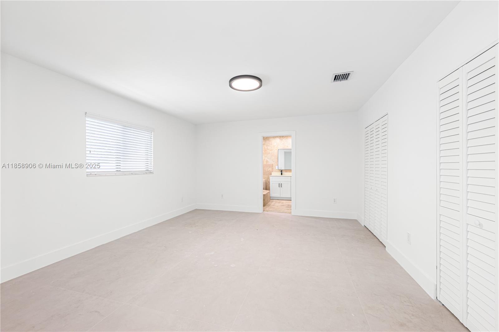 11835 Southwest 37th Street Miami, FL 33175 - Photo 18 of 47 an empty room with windows