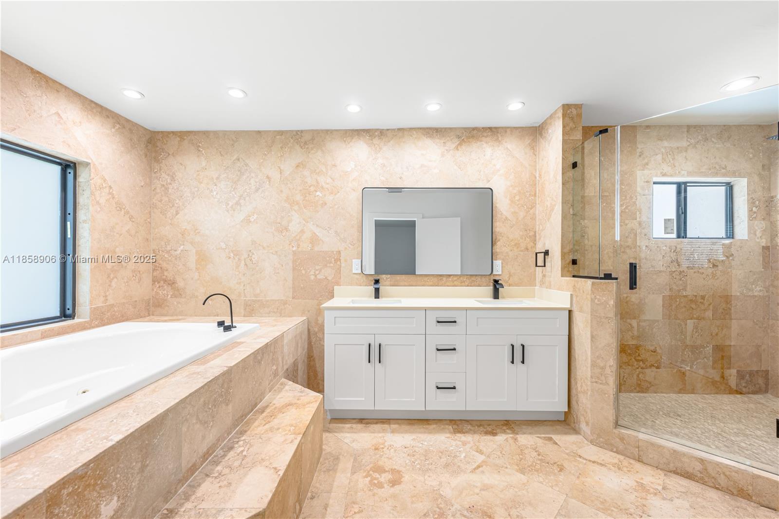 11835 Southwest 37th Street Miami, FL 33175 - Photo 20 of 47 a spacious bathroom with a tub sink and mirror