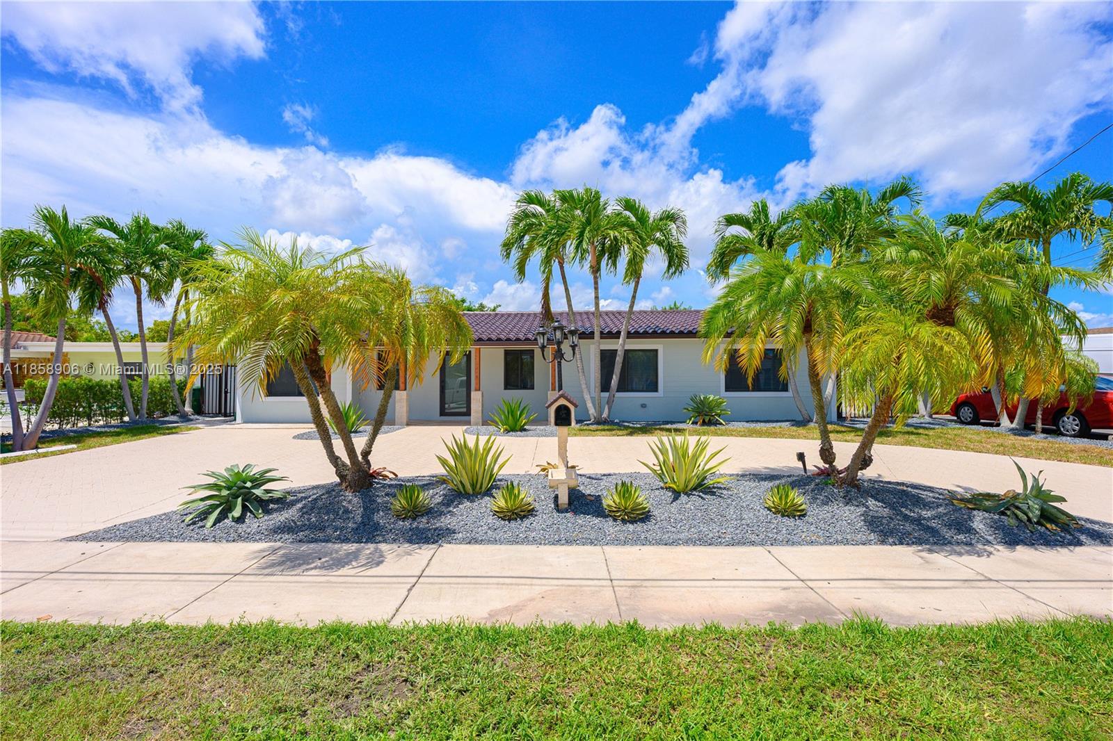 11835 Southwest 37th Street Miami, FL 33175 - Photo 2 of 47 a front view of a house with garden