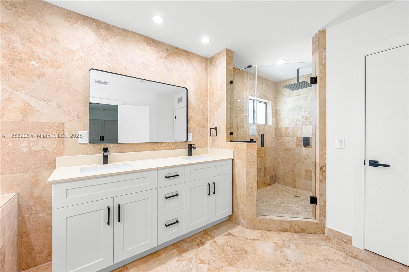 11835 Southwest 37th Street Miami, FL 33175 - Photo 21 of 47 a bathroom with a shower sink and mirror