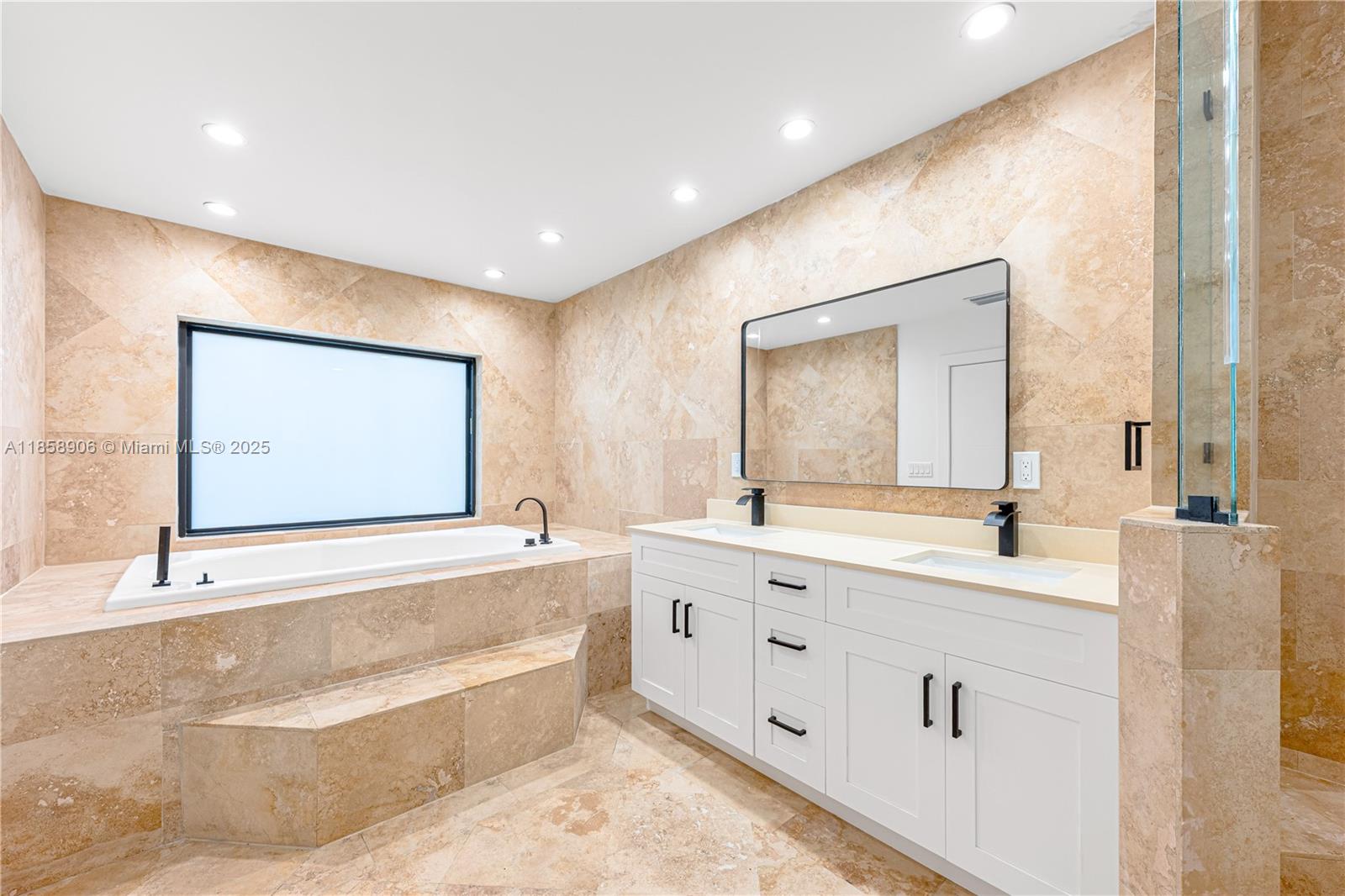 11835 Southwest 37th Street Miami, FL 33175 - Photo 22 of 47 a bathroom with a bathtub sink and mirror