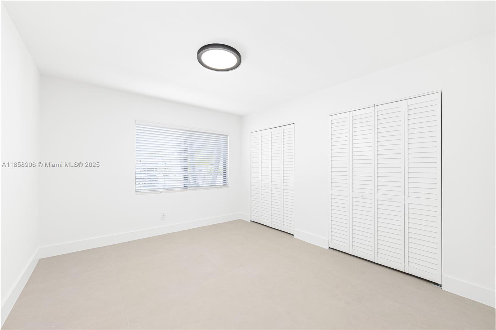 11835 Southwest 37th Street Miami, FL 33175 - Photo 26 of 47 a view of an empty room with a window