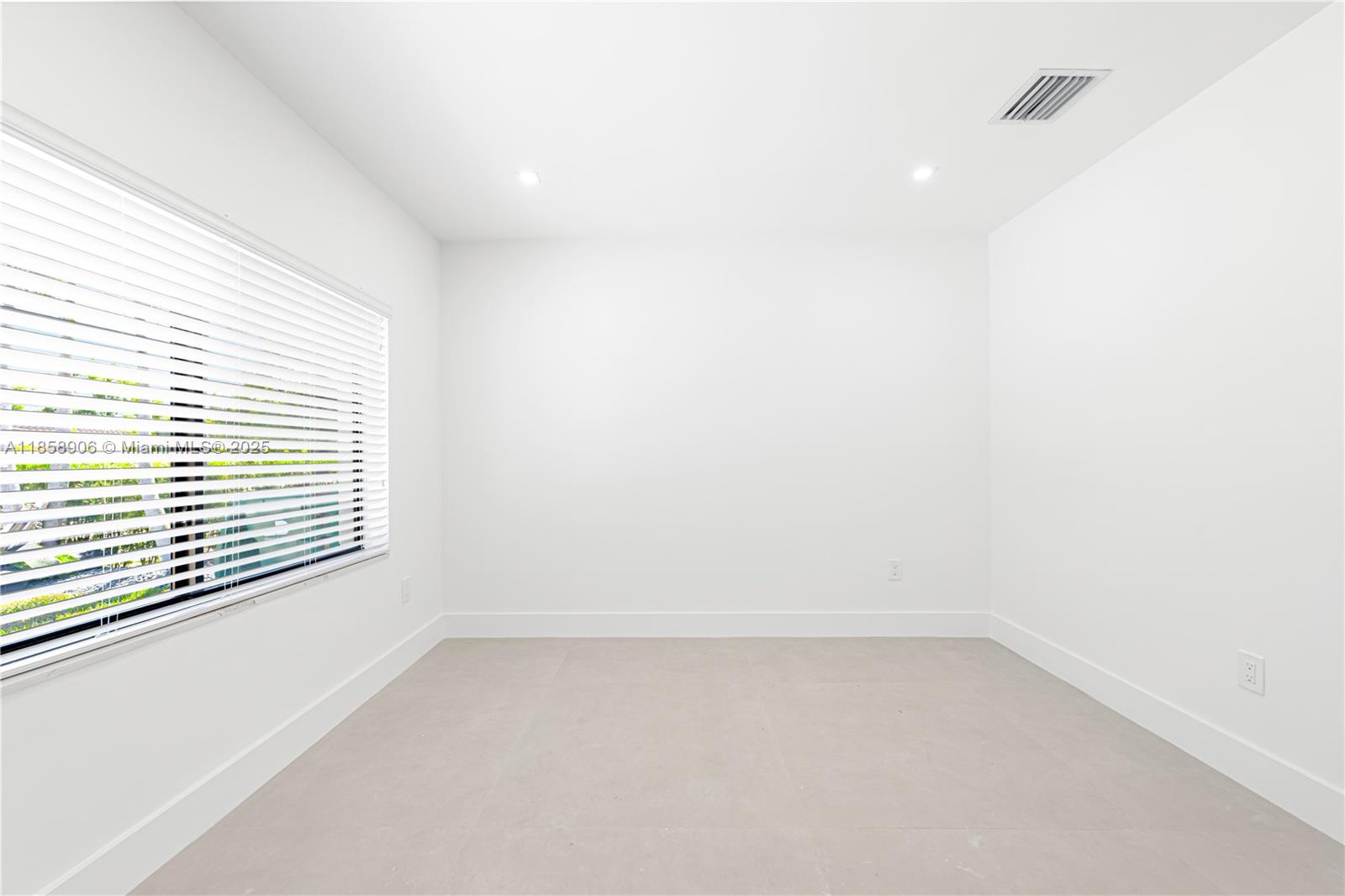 11835 Southwest 37th Street Miami, FL 33175 - Photo 32 of 47 a view of an empty room with a window