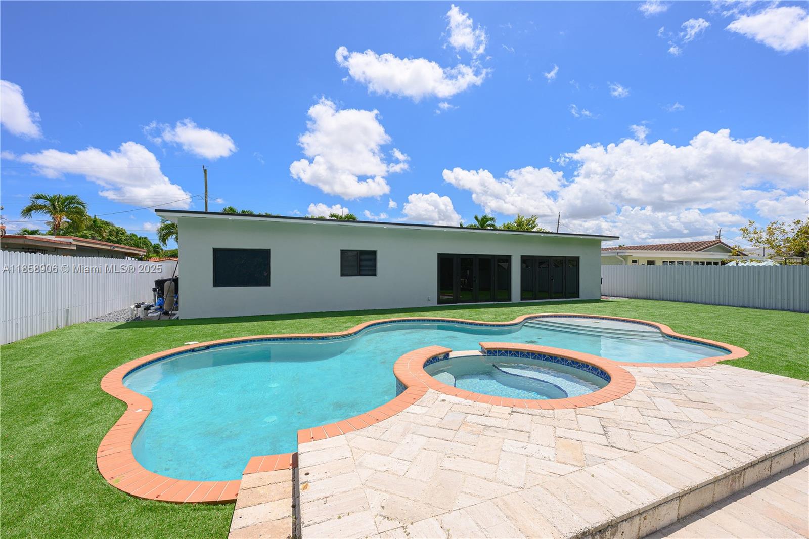 11835 Southwest 37th Street Miami, FL 33175 - Photo 39 of 47 a view of a swimming pool with a yard
