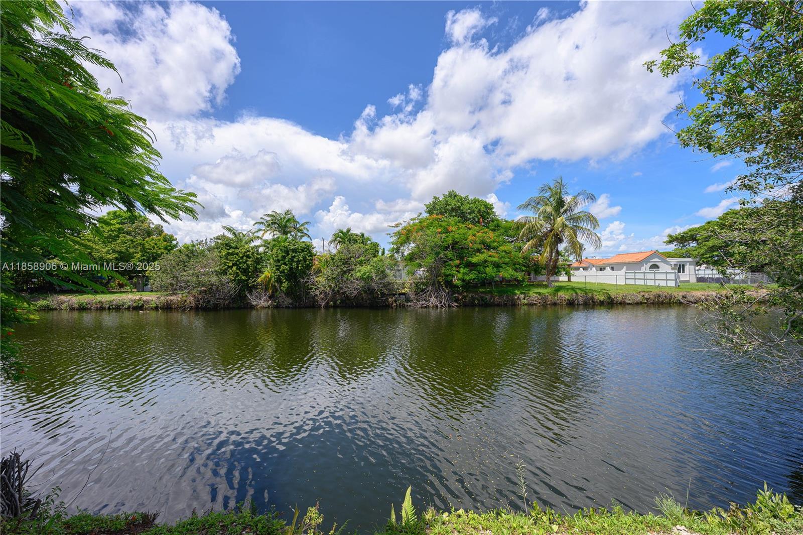11835 Southwest 37th Street Miami, FL 33175 - Photo 42 of 47 a view of a lake with houses in the background