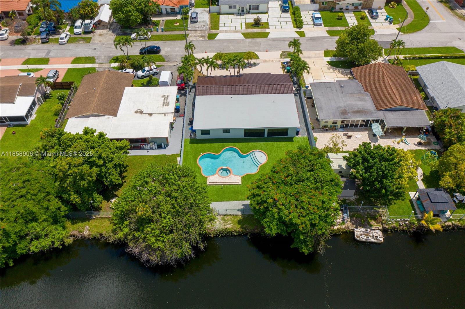 11835 Southwest 37th Street Miami, FL 33175 - Photo 47 of 47 an aerial view of a house with a garden and swimming pool