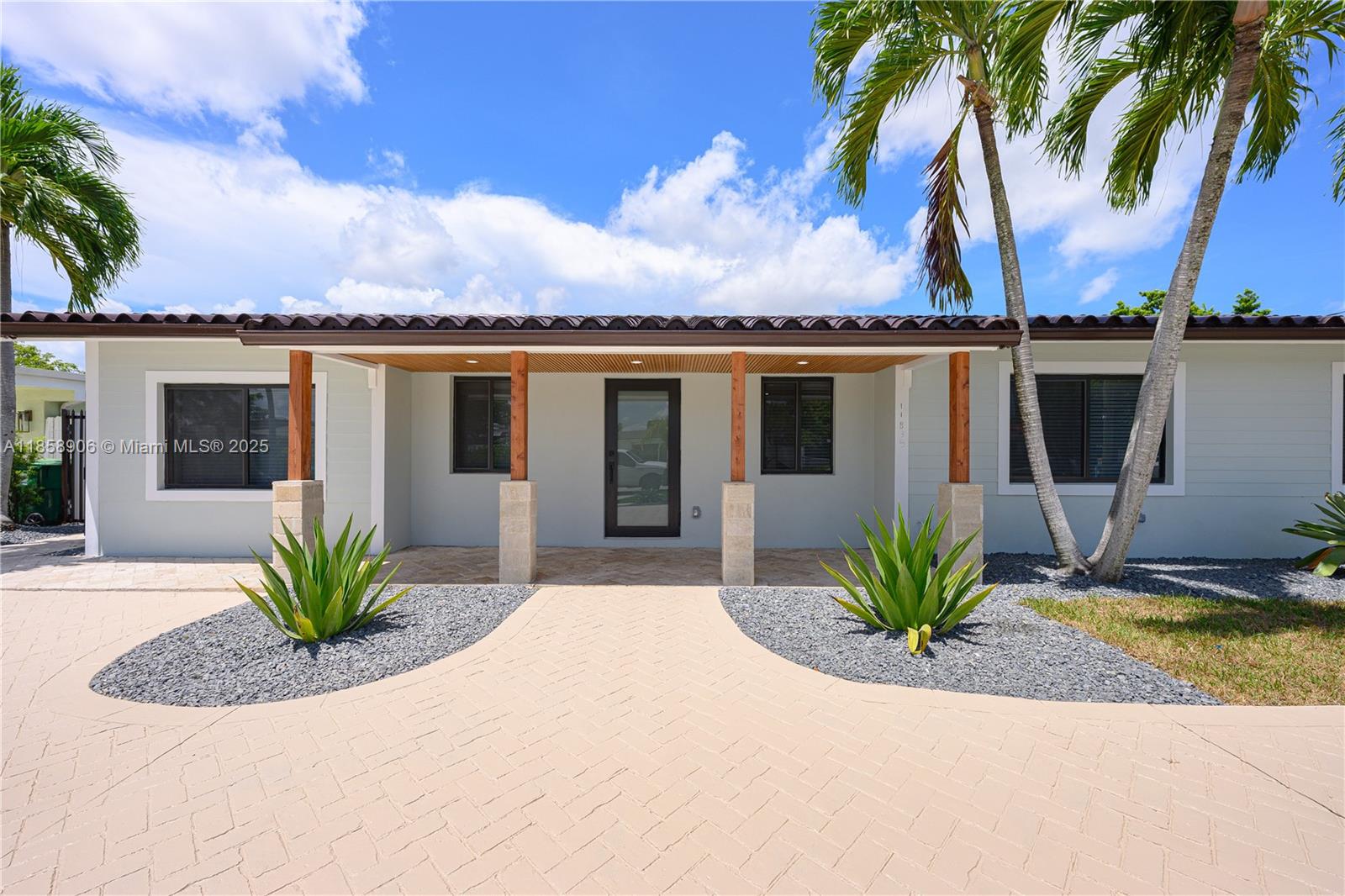 11835 Southwest 37th Street Miami, FL 33175 - Photo 5 of 47 a view of a house with a swimming pool and a porch