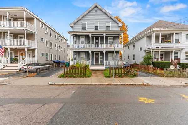 a front view of a building with a street