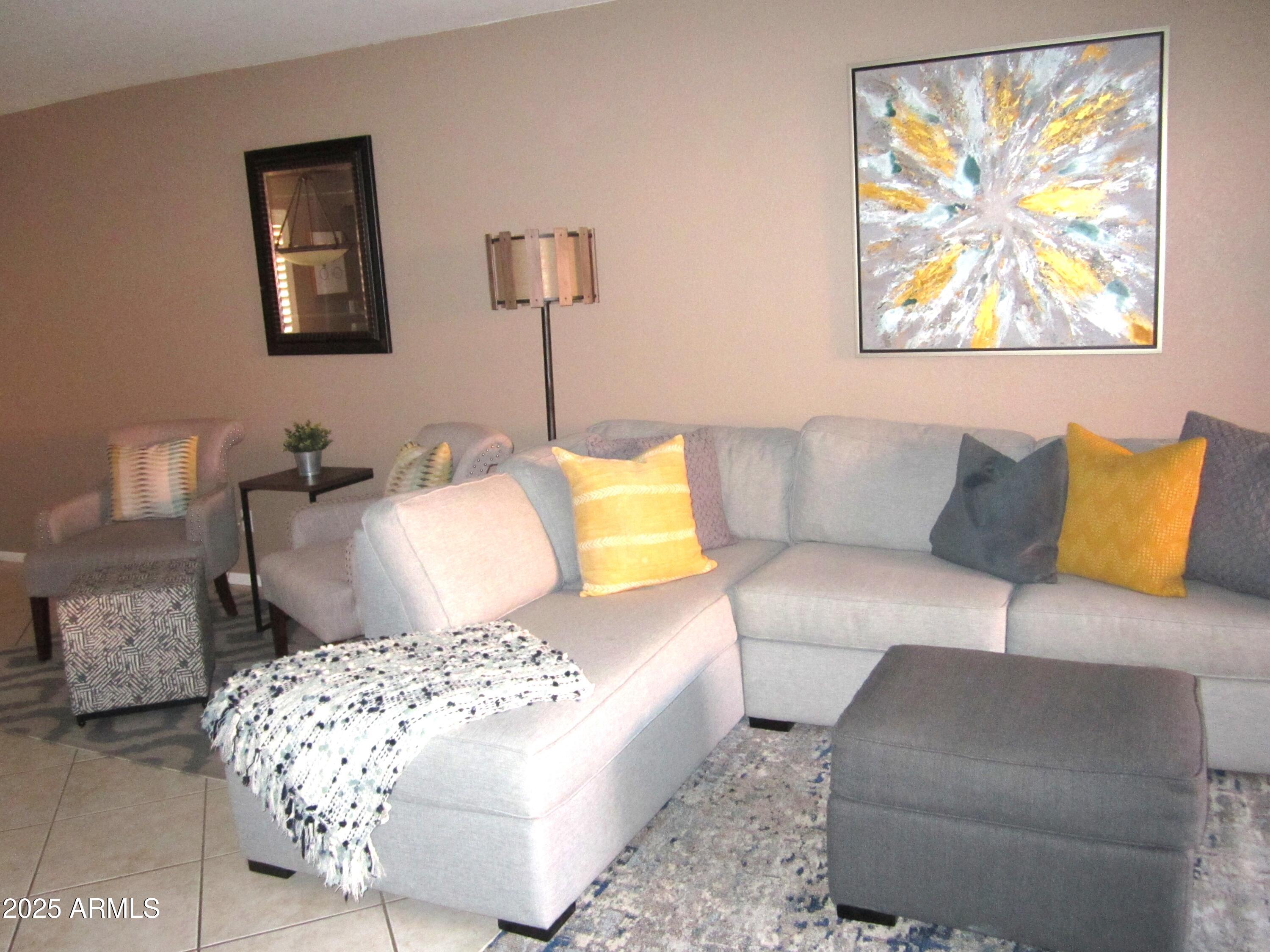 4303 East Cactus Road, Unit 116 Phoenix, AZ 85032 - Photo 4 of 35 a living room with furniture and a painting