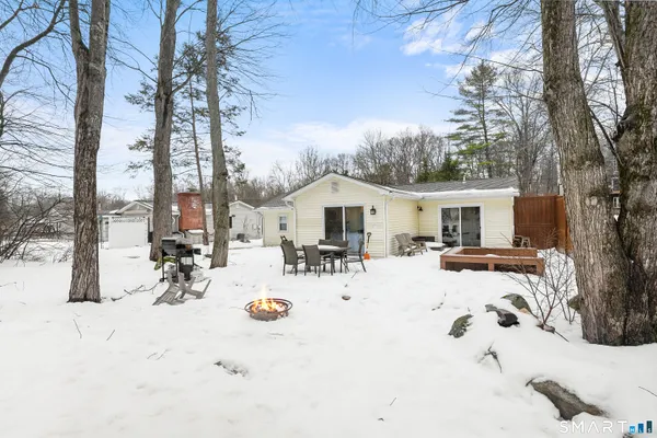 a view of backyard of the house