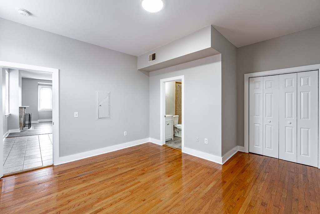238-240 Union Street Springfield, MA 01105 - Photo 14 of 17 wooden floor in an empty room with a window