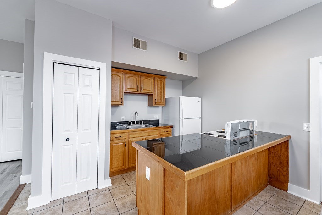 238-240 Union Street Springfield, MA 01105 - Photo 10 of 17 a kitchen with stainless steel appliances a sink a stove a refrigerator a counter top space and cabinets