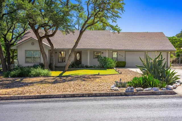 a view of house with a swimming pool