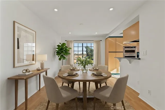 a view of a dining room with furniture and a window