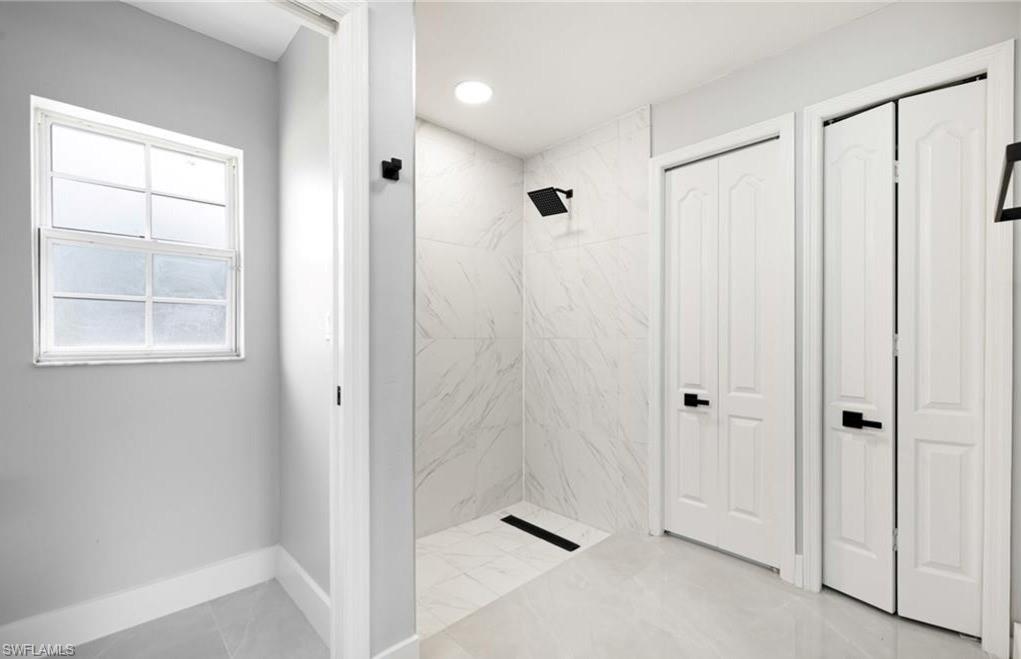 116 Ridgemont Drive Lehigh Acres, FL 33972 - Photo 24 of 45 a view of a bathroom with a shower