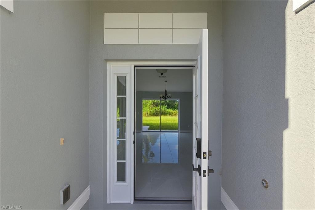 116 Ridgemont Drive Lehigh Acres, FL 33972 - Photo 4 of 45 a hallway with a window