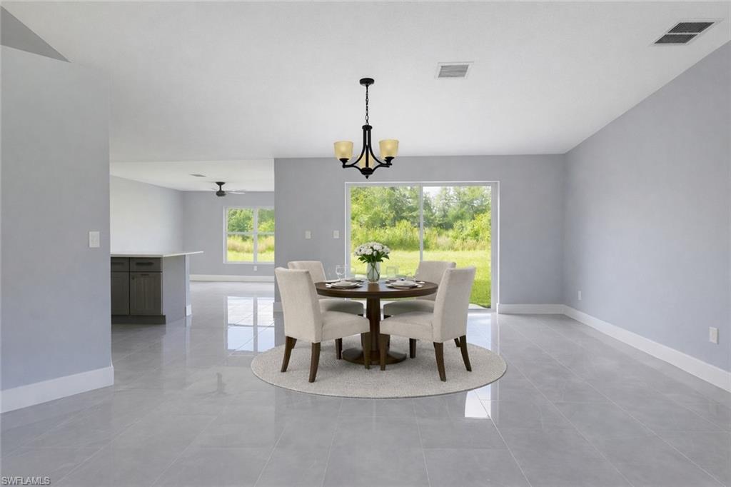 116 Ridgemont Drive Lehigh Acres, FL 33972 - Photo 6 of 45 a view of a dining room with furniture window and outside view