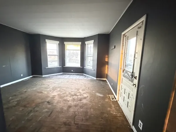 a view of an empty room with a window