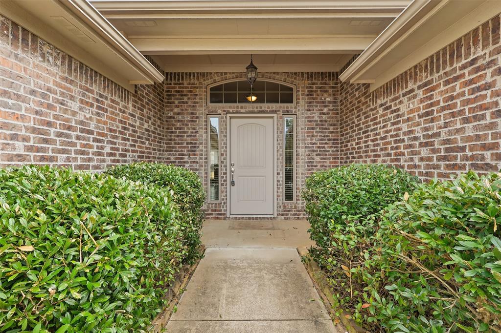2512 Guinn Farms Road Tyler, TX 75707 - Photo 2 of 29 a front view of a house with a yard