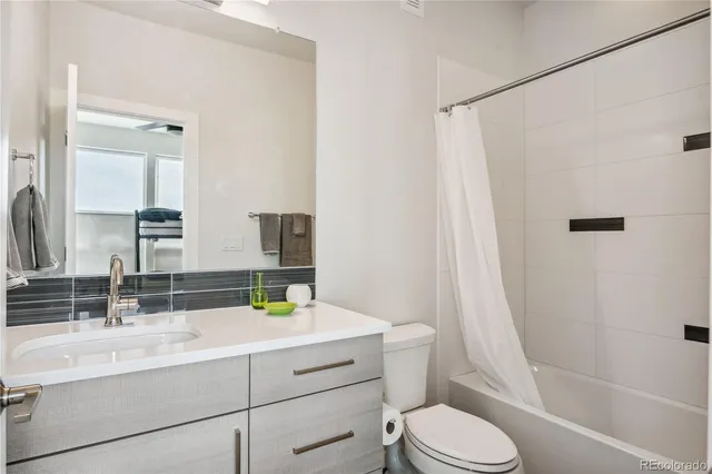 a bedroom with a large bed and a large window