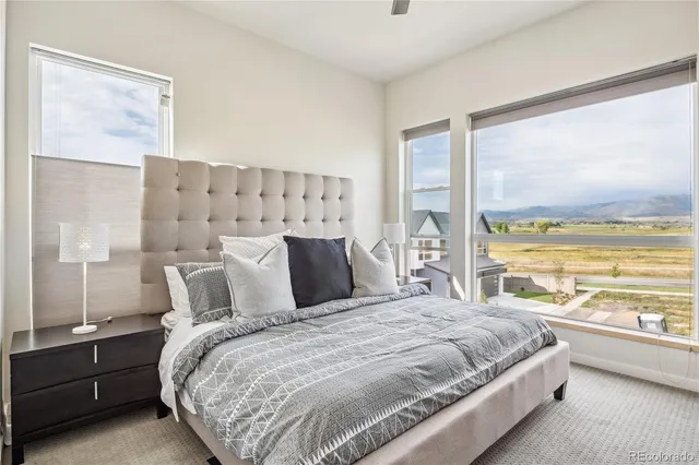 a bathroom with a double vanity sink toilet and shower