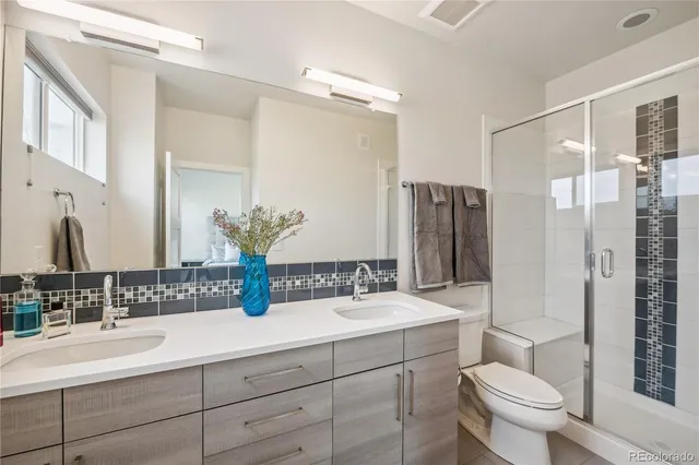 a view of swimming pool with outdoor seating and city view