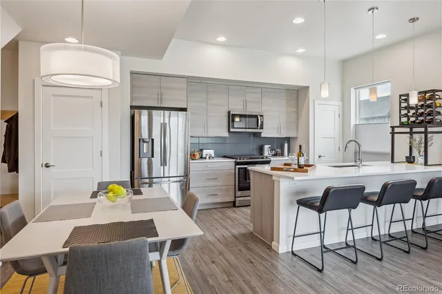 a bedroom with furniture and a large window