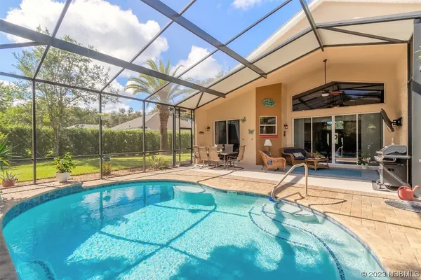 a view of indoor pool and sitting area