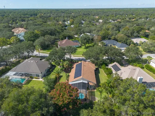an aerial view of house with yard