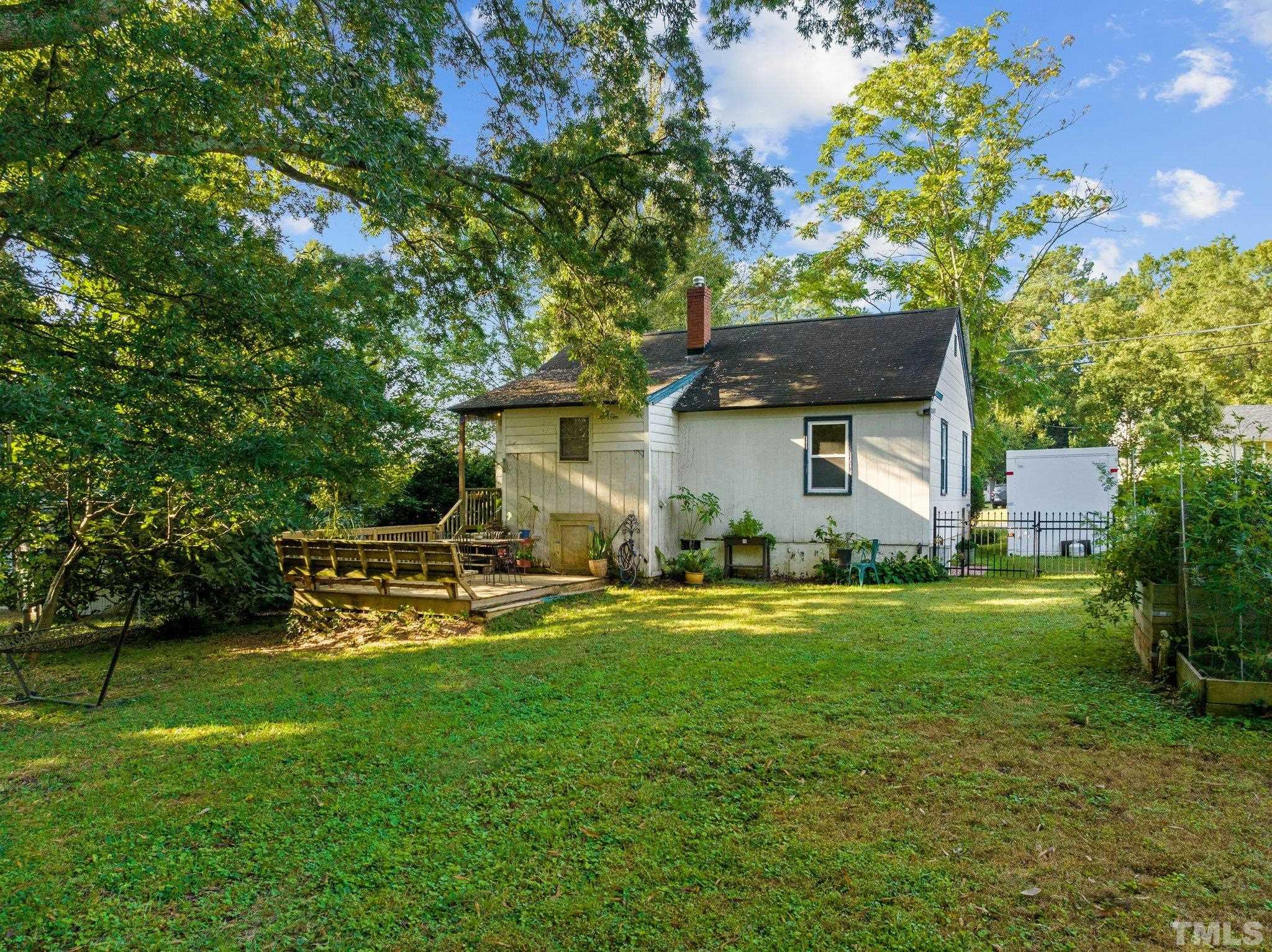 2615 Layden Street Raleigh, NC 27603 - Photo 20 of 34 a front view of a house with garden