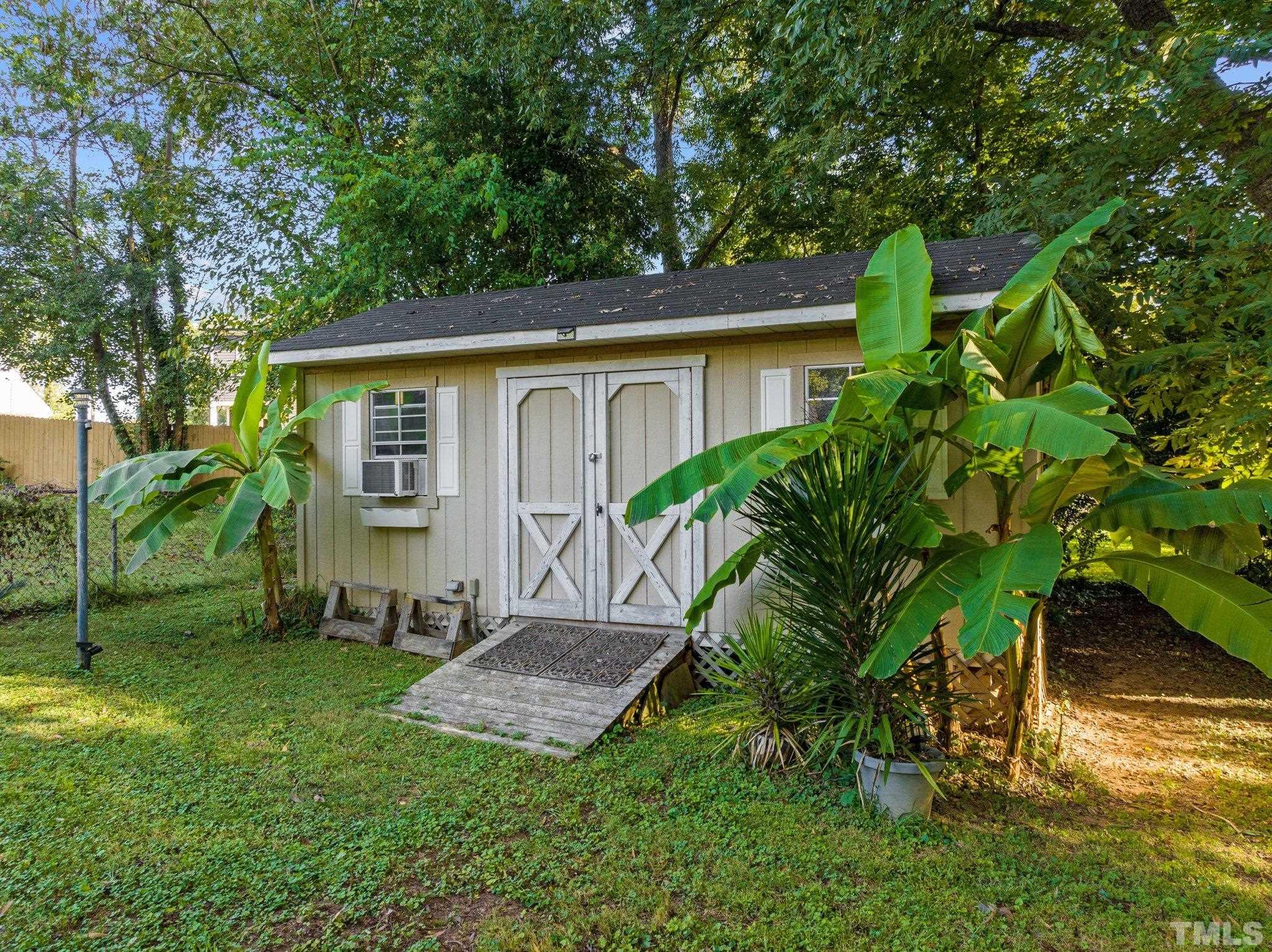 2615 Layden Street Raleigh, NC 27603 - Photo 23 of 34 a view of a house with a yard