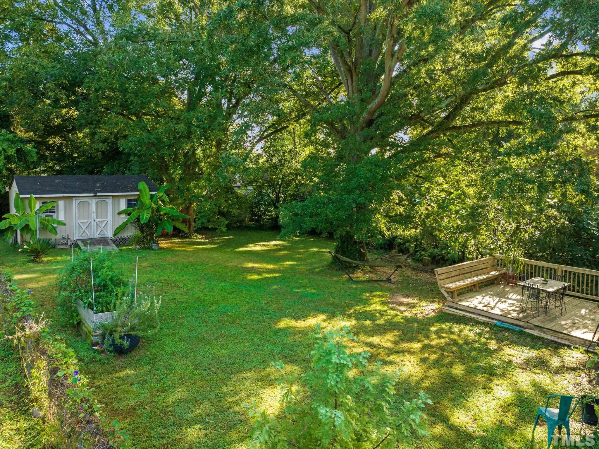 2615 Layden Street Raleigh, NC 27603 - Photo 26 of 34 a view of a backyard with a garden
