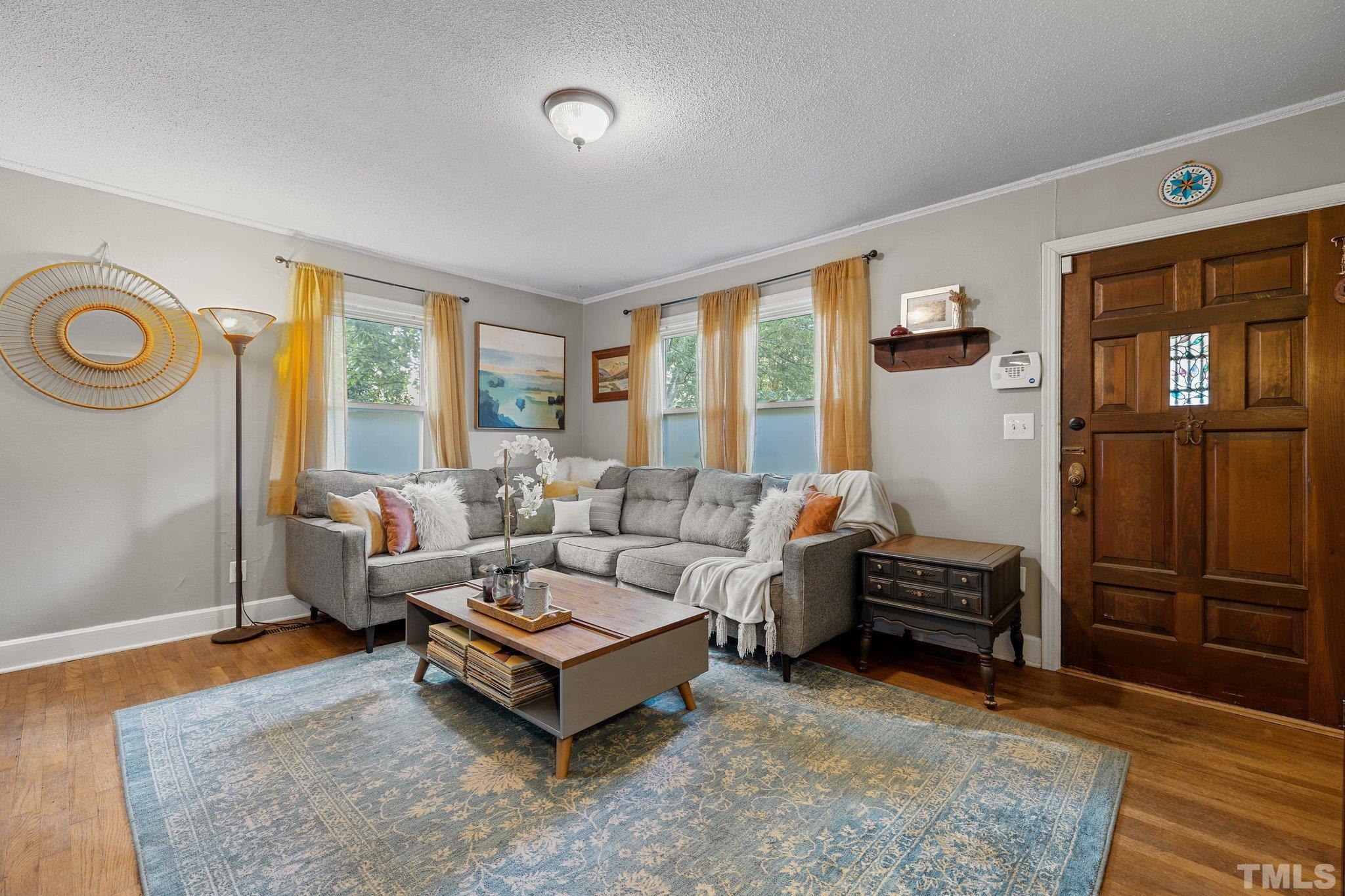2615 Layden Street Raleigh, NC 27603 - Photo 5 of 34 a living room with furniture and a window