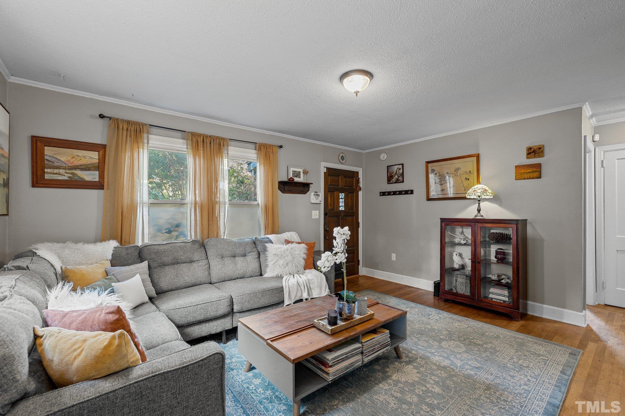 2615 Layden Street Raleigh, NC 27603 - Photo 6 of 34 a living room with furniture and a large window
