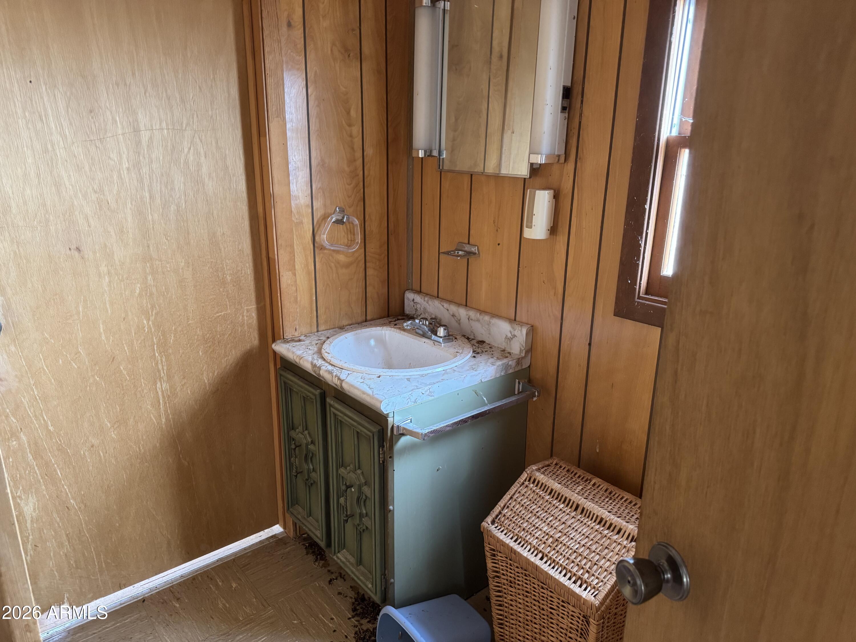 75 North County Road Chambers, AZ 86502 - Photo 13 of 14 a bathroom with a sink a toilet and a mirror