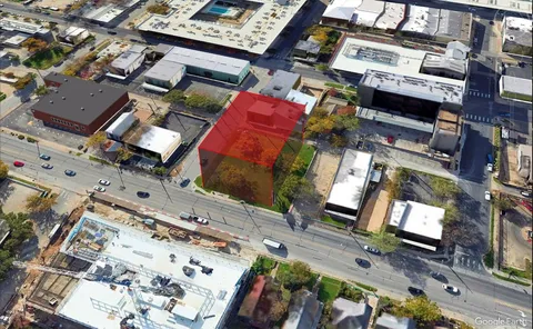an aerial view of a house with a garden