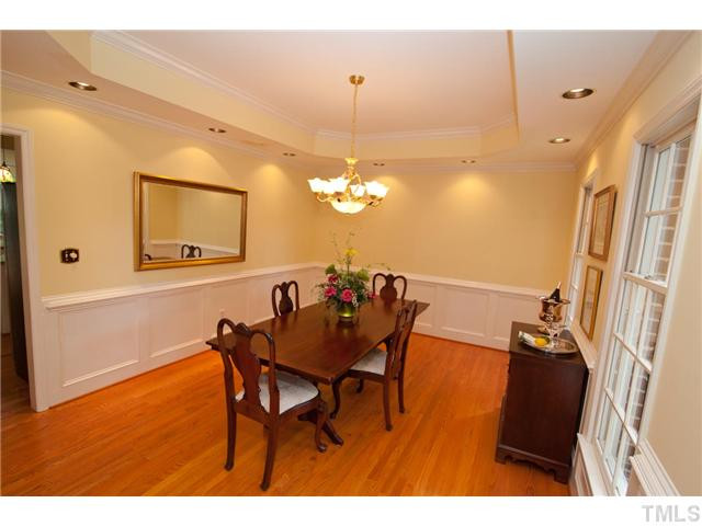 12400 Glenlivet Way Raleigh, NC 27613 - Photo 11 of 24 This Dining Room is Large - and can Accommodate your Friends and Family. It has been Recently Painted with a Nice, Neutral Color. The Wainscoting and Tray Ceiling add to the Atmosphere of this Room. Dining Room