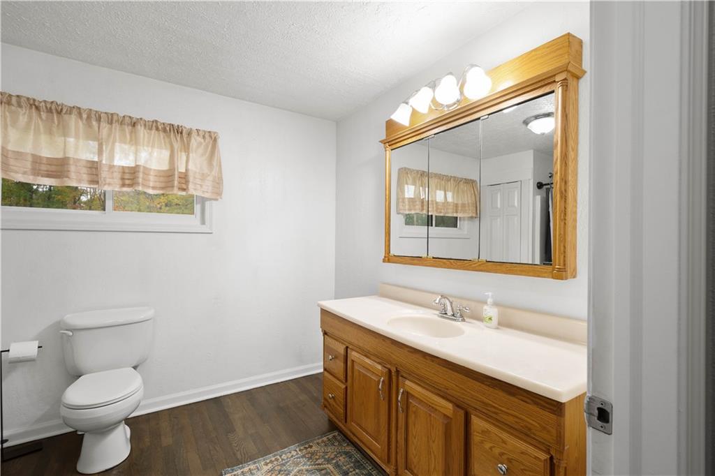 186 Gretna Road Washington, PA 15301 - Photo 13 of 48 a bathroom with a granite countertop sink toilet and mirror