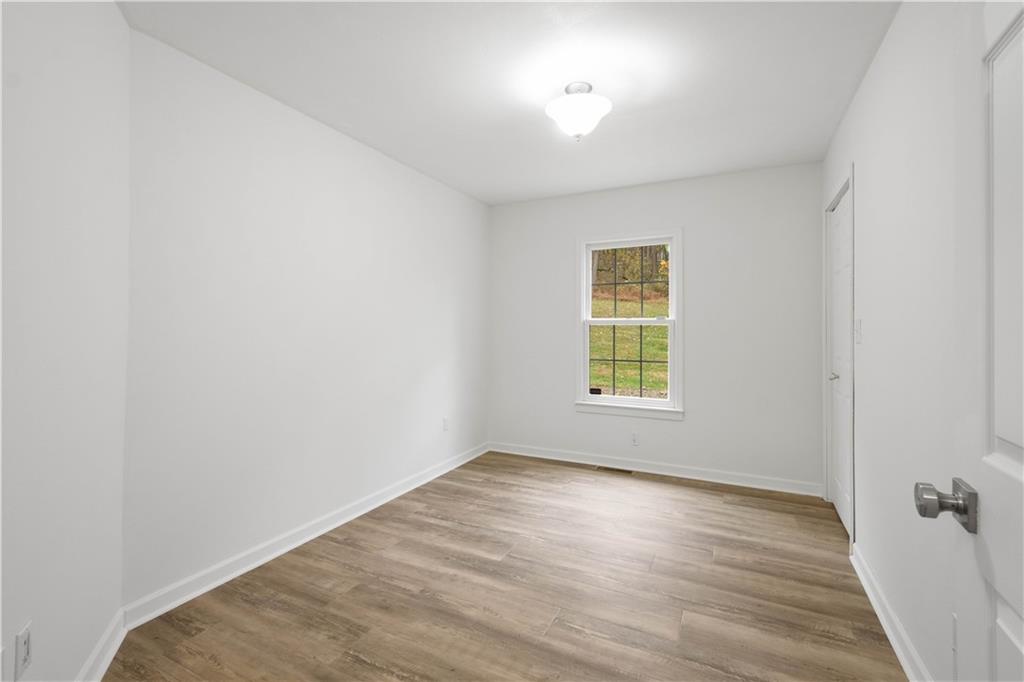 186 Gretna Road Washington, PA 15301 - Photo 19 of 48 a view of empty room with wooden floor and fan