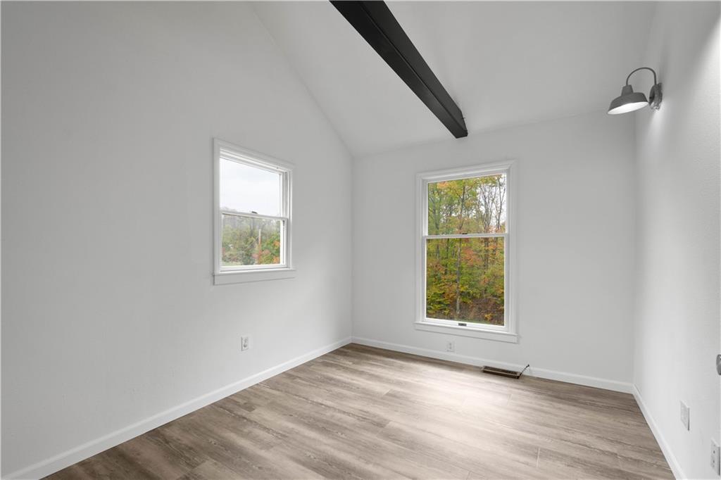 186 Gretna Road Washington, PA 15301 - Photo 20 of 48 an empty room with wooden floor cabinet and windows