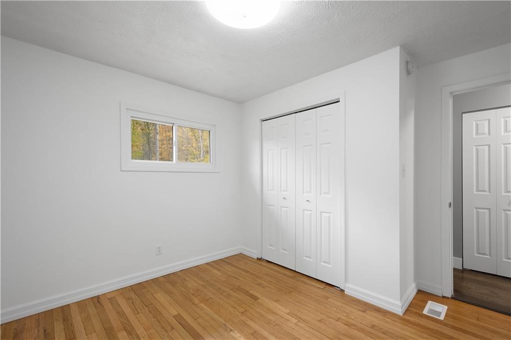 186 Gretna Road Washington, PA 15301 - Photo 23 of 48 a view of an empty room with wooden floor and a window