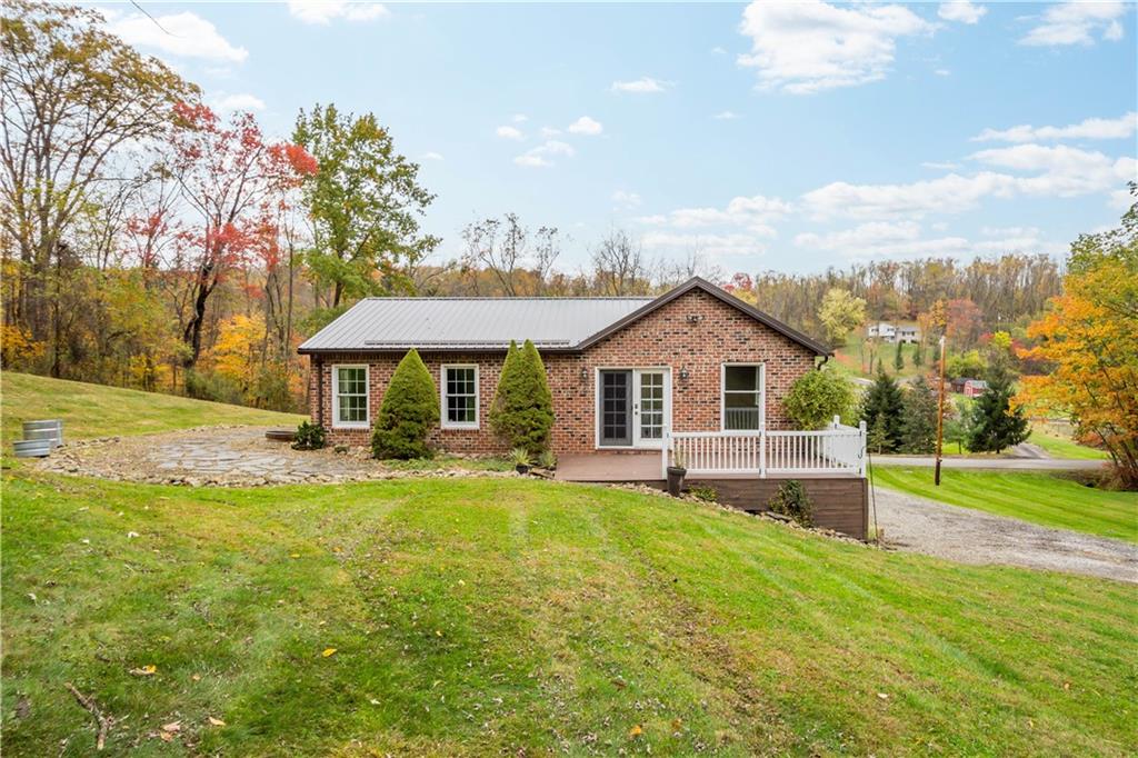 186 Gretna Road Washington, PA 15301 - Photo 33 of 48 a front view of a house with a yard table and chairs