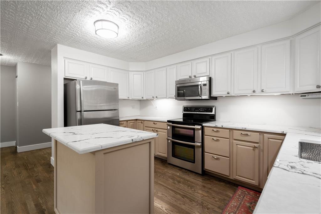 186 Gretna Road Washington, PA 15301 - Photo 6 of 48 a kitchen with a stove a sink and a refrigerator