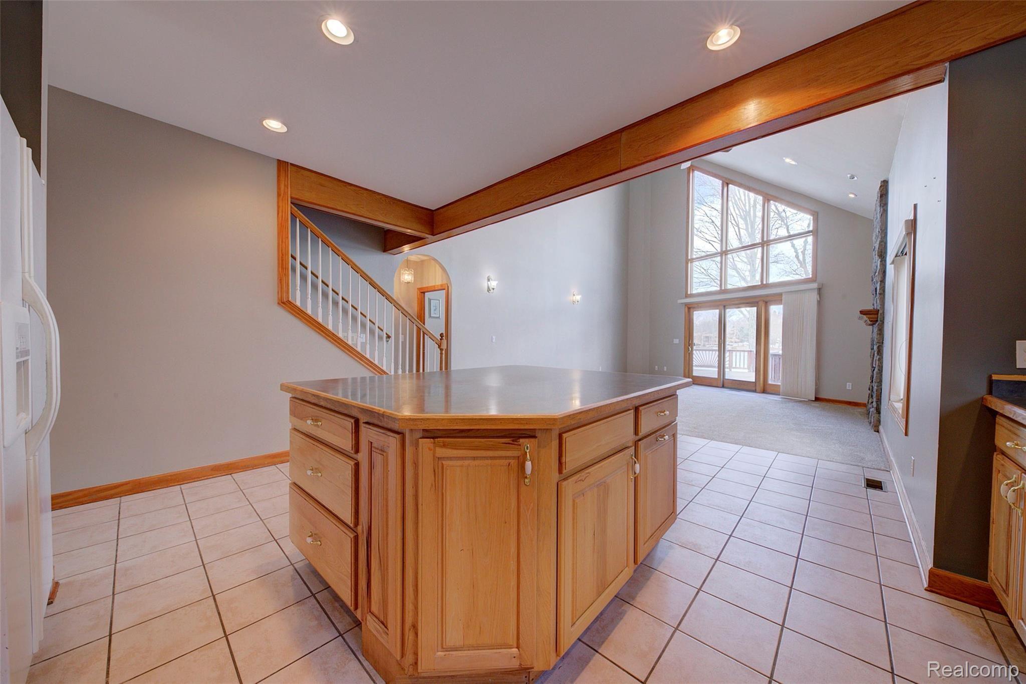 7154 Hatchery Road Waterford, MI 48327 - Photo 37 of 80 KITCHEN ISLAND TO FAMILY ROOM VIEW