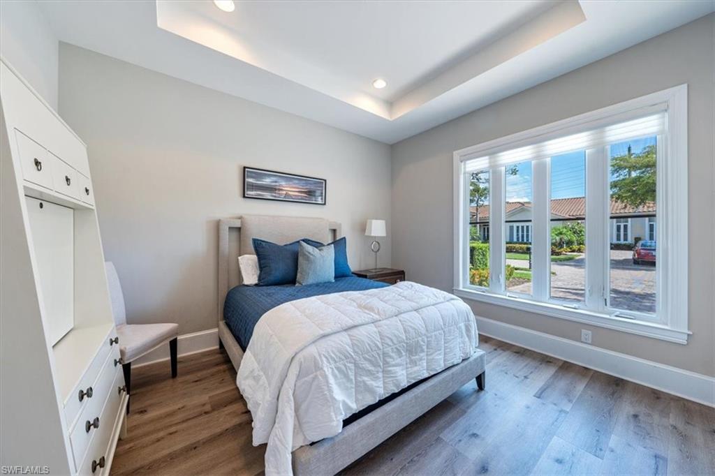 2139 Torino Way Naples, FL 34105 - Photo 18 of 24 a bedroom with a bed and a large window